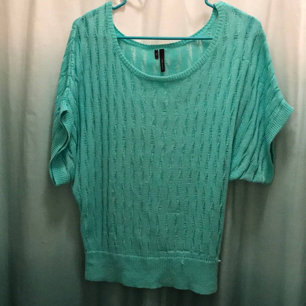 Turquoise knit top.